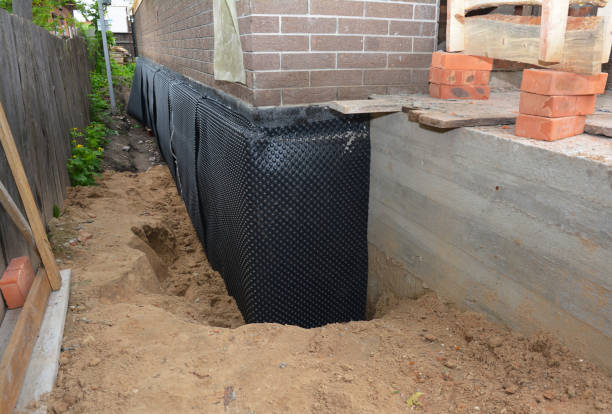 Happy homeowners after waterproofing job in Annapolis